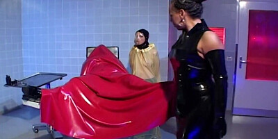 Fetish scene with lots of latex and some intense fisting