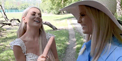 Candee Licious and Emily Belle licking in the woods