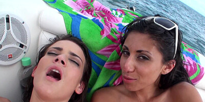Two girls that shave their cunts fuck each other on the boat