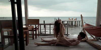 Horny couple is having sexual intercourse by the sea