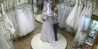 Shy bride topless for dress fittings