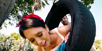 Young girl does it with man on a public parc tire swing