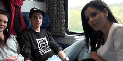Euro minx is having naughty fun with a young couple in a train coupe